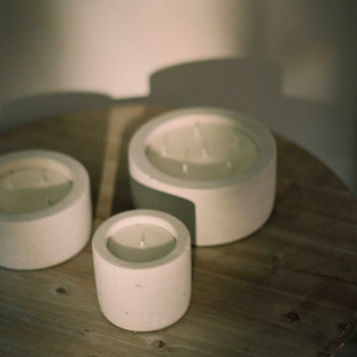a film shot of white concrete candles