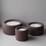 range of brown concrete candles in mocha